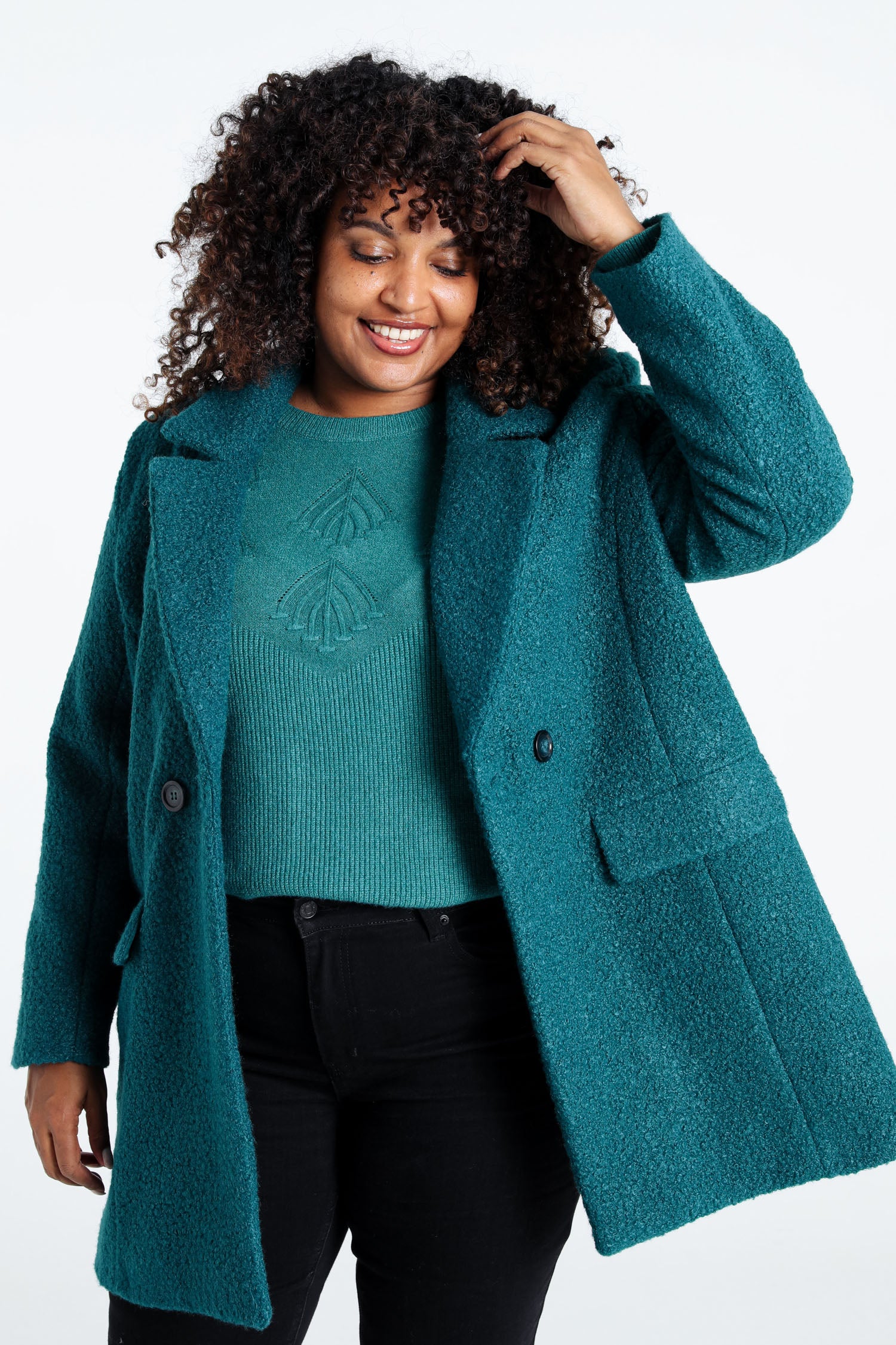 Manteau mi-long uni maille bouclette
